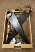 Collection of vintage tools including three saws, moulding plane, three sharpening stones,