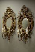 Pair 19th century ornate giltwood and gesso oval girandoles,