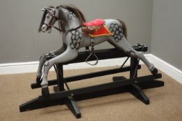 Small Dapple Grey painted rocking horse on trestle base,