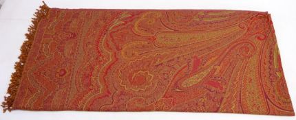 Large red ground paisley shawl with fringe edge,