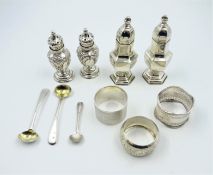 Two pairs hallmarked silver pepper pots, matched pair of Georgian silver salt spoons,