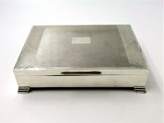 Silver cigarette box, engine turned decoration, stepped bracket feet by Edward Viners,