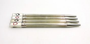 Set of four silver and enamel bridge propelling pencils, stamped sterling silver,