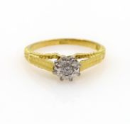 Single stone diamond ring, illusion set, stamped 18ct Condition Report Size N - O,