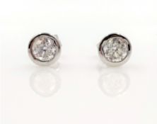 Pair of 18ct white gold rubover diamond stud ear-rings stamped 750 approx 1.