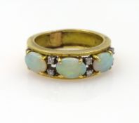 Opal and diamond gold ring, three opals and eight diamonds, stamped 18k 750 approx 7.