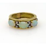 Opal and diamond gold ring, three opals and eight diamonds, stamped 18k 750 approx 7.