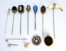 Two diamond and pearl gold stick pins tested 14ct,