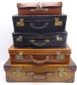 Two early 20th century leather suitcases,