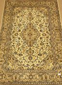 Persian Kashan ivory ground rug, blue interlacing foliage overall design with medallion,