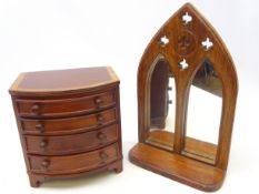 Small bow front four drawer trinket chest and a Gothic style mirror,