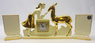 French Art Deco Berlot & Mussier, ODYV clock garniture, the clock moulded as a girl feeding a deer,