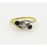 Sapphire and diamond three stone gold ring stamped 18ct Condition Report 2.