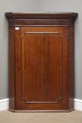 18th century oak corner cupboard, single door enclosing painted interior with three shaped shelves,