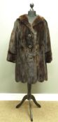 Mink three quarter length fur jacket, with leather and beaded buttons,