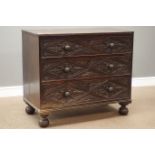 19th century oak three drawer chest, drawer fronts carved with foliage lozenges, on bun feet, W97cm,