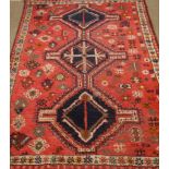 Persian Shiraz rug, red ground with triple pole medallion,