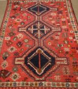 Persian Shiraz rug, red ground with triple pole medallion,