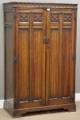 Medium oak linenfold tall boy gentleman's wardrobe, interior fitted with shelving and hanging rail,