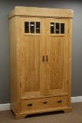 Early 20th century waxed pine double wardrobe with drawer to base, W108cm, H190cm,