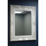 Rectangular wall mirror in white swept frame,