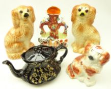 Pair of Staffordshire dogs with glass eyes, another Staffordshire dog,