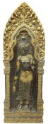 Carved giltwood panel depicting Guanyin stood holding a lotus flower within temple arch,