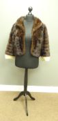 Brown mink fur cape with blonde mink cuffs, retailed by Lucas,