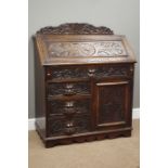 Victorian oak bureau, fall front above four drawers and cupboard,