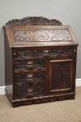 Victorian oak bureau, fall front above four drawers and cupboard,