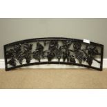 Arched cast iron bench back decorated with grapes and foliage, W116cm,