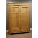 20th century waxed pine 'knock down' wardrobe, two panelled doors enclosing hanging space,