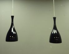 Pair black glass light pendants with chrome fittings, retailed by Heals,