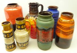 Seven West German vases/ stick stands, some having lava style decoration,