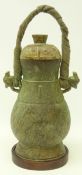 Chinese archaic style bronze ritual wine vessel and cover, cast in relief with bovine masks,