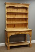Polished pine dresser, four heights plate rack above two drawers and undertier, turned supports,