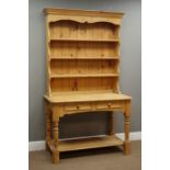 Polished pine dresser, four heights plate rack above two drawers and undertier, turned supports,