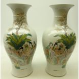 Pair Chinese baluster vases decorated in polychrome enamels with maidens and children in a fenced