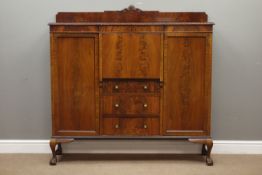 Early 20th century mahogany break front secretaire bookcase, raised back with shell carved pediment,