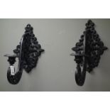 Pair black painted cast iron wall mounted candle sconces,