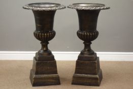 Pair Victorian style bronze finish cast iron urns on plinths D45cm,