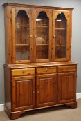Ducal polished pine dresser, three drawers and three panelled cupboards,