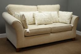 Three piece lounge suite; three seat sofa upholstered in cream fabric (W190cm, D101cm),