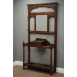 20th century oak hall stand, bevelled mirror back with hinged compartment,