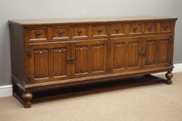 Mid 20th century oak dresser sideboard fitted with four drawers and four linen-fold cupboards,