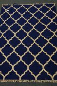 Rajastani blue ground geometric quatrefoil rug,
