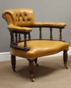 20th Century tub shaped armchair upholstered in buttoned golden tan leather,