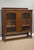 Early 20th century oak bookcase fitted with two glazed doors, W130cm, H135cm,