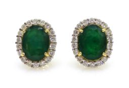 Pair of oval cut emerald and diamond gold cluster stud ear-rings, hallmarked 18ct,