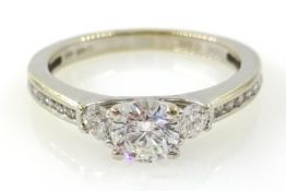 Three stone round brilliant cut diamond 18ct white gold ring,